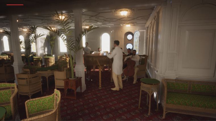 The first class Palm Court with wicker chairs, potted palms, a red patterned carpet and musicians playing a piano and cello